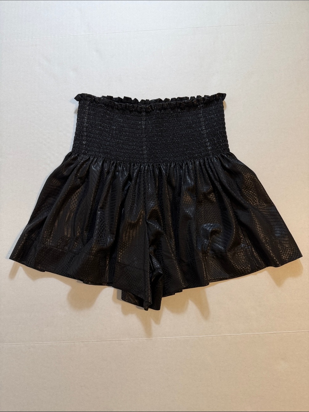 Queen of Sparkles black snake skin patterned smocked-waist shorts